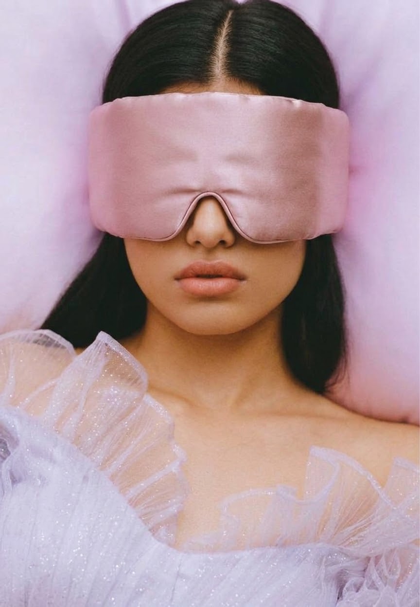 Model wearing The Veil, the rose mulberry silk sleep mask